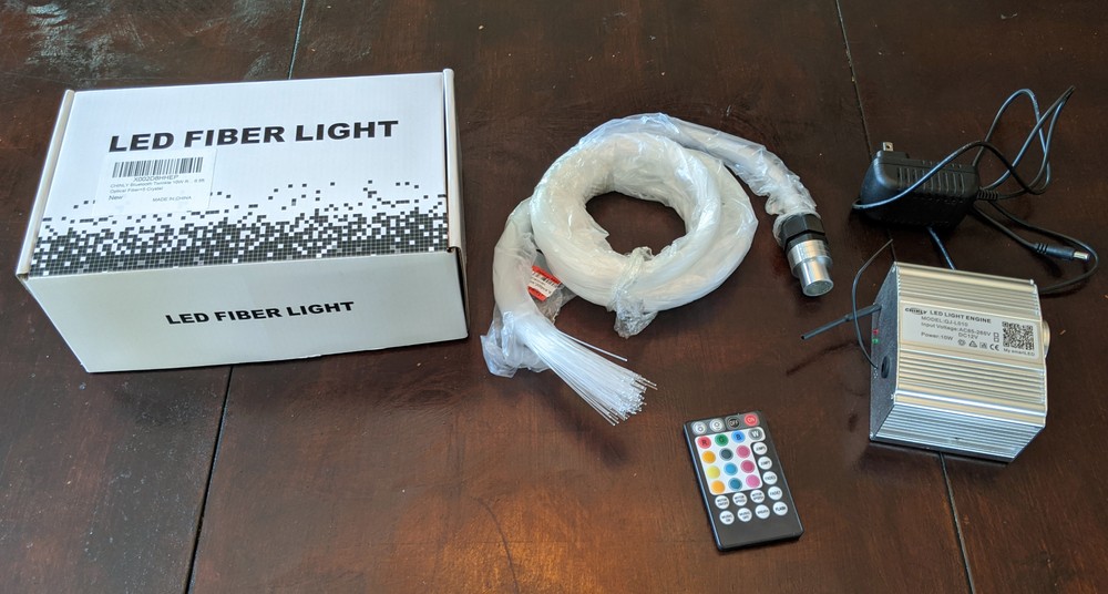 LED light engine and fiber optic strand bundle